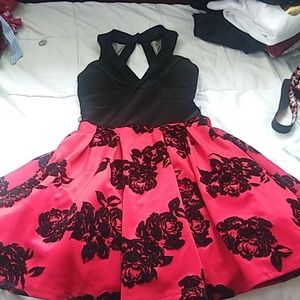 A black and red dress with black flowers